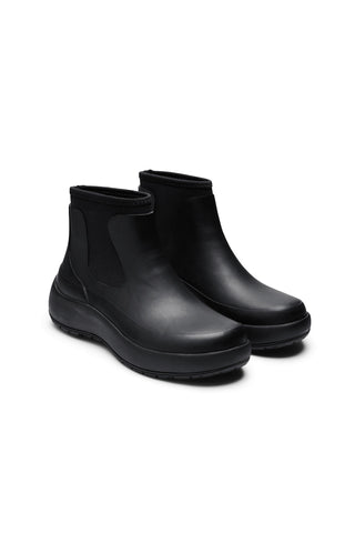 Pair of brown ankle boots on a white background
