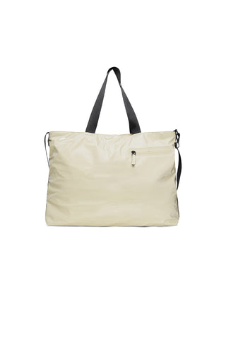 Shiny beige large messenger tote bag with black carry handles. 