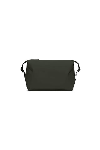 Burgundy toiletry bag with side buckles in front of white background. 