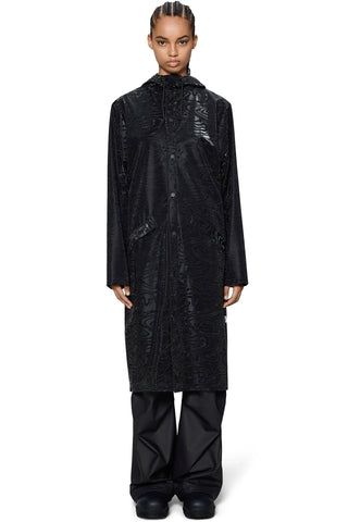 Person wearing black long rain jacket. 