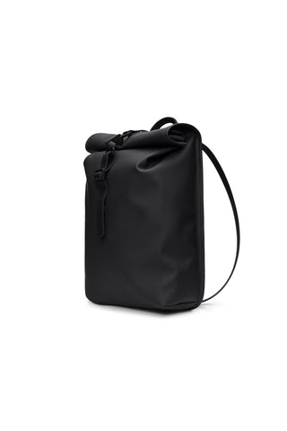 A black waterproof roll-top backpack with a drawstring closure and a single shoulder strap, shown from a three-quarter angle on a white background.