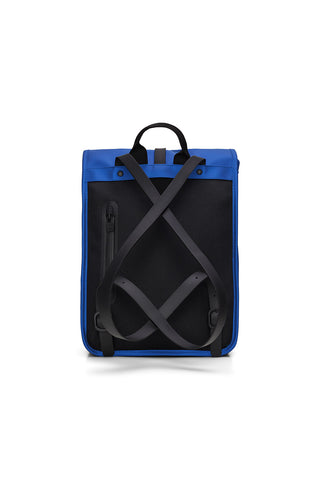 Back view of vibrant blue Roll Top Mini W3 backpack by RAINS. 