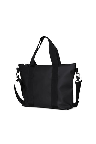 Side view of black RAINS Tote Bag Micro against white background. 