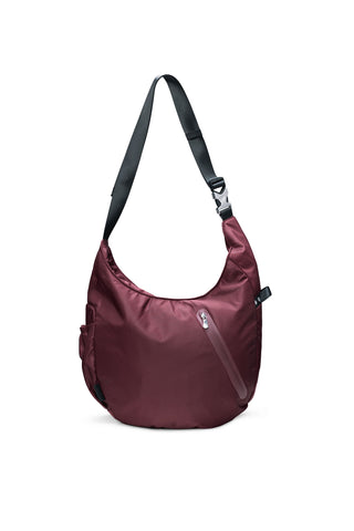 A burgundy nylon shoulder bag with a black adjustable strap, shown on a plain white background.