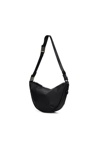 A black crescent shaped shoulder bag against a white background. 