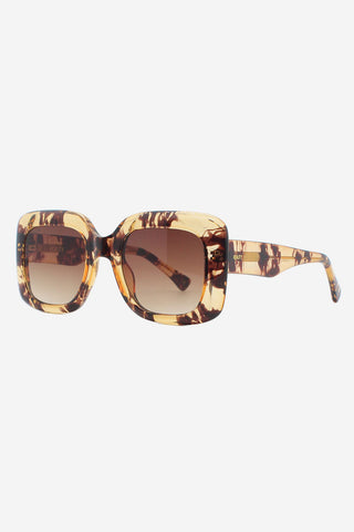 Transparent tortoise shell oversized square shaped sunglasses. 