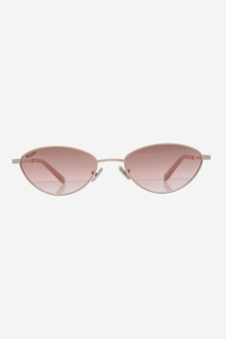 Light gold metal sunglasses with rose gold lenses in front of white background. 