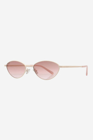 Light gold metal sunglasses with rose gold lenses in front of white background. 