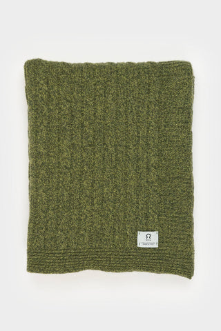 Green recycled cashmere cable knit Elide blanket by Rifo. 
