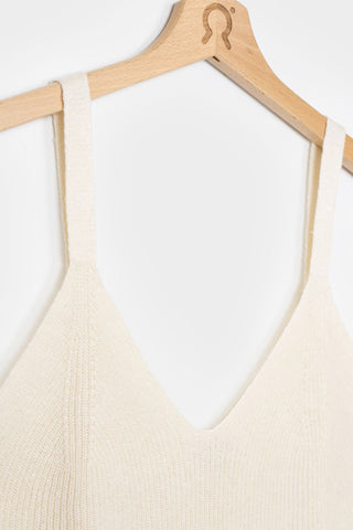 Close-up of white v-neck recycled silk Grace tank top by Rifo. 