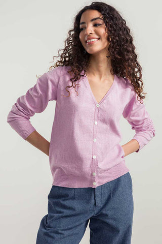 Woman wearing pink organic / recycled cotton Lucia cardigan by Rifo. 