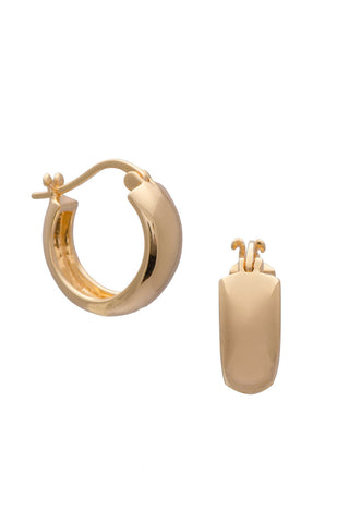 Gold chunky hoop earrings against white backdrop. 