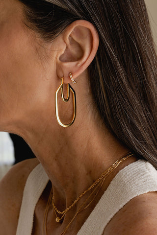 Close-up of model wearing 24K Gold plated Miranda Earring by Sarah Mulder. 