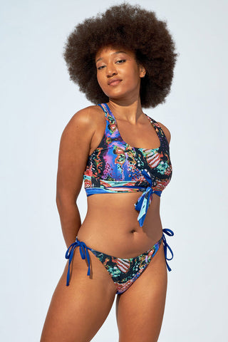 Model wearing low rise recycled polyester Leah bikini bottom by Selfish Swimwear. 