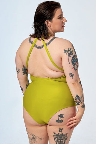 Model wearing lime green recycled polyester Samantha one-piece swimsuit by Selfish. 