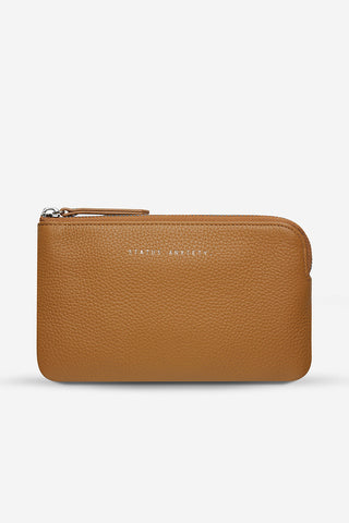 Tan leather Smoke & Mirror pouch by Status Anxiety. 
