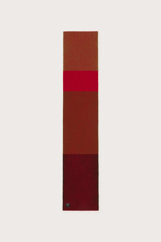 Flat lay image of orange and brown stripe wool rib knit Ghede Scarf. 