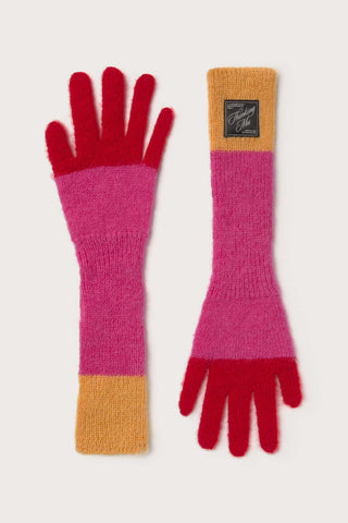 Flat lay image of pink, red & yellow Maggie gloves by Thinking Mu. 