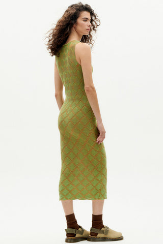 Woman wearing green organic cotton Pippi bodycon dress by Thinking Mu. 