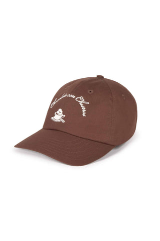 Brown organic cotton baseball cap with white "chocolate com churros" embroidery shown on white background. 
