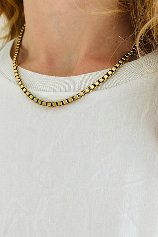 Model wearing Tilly Doro vintage box chain necklace. 