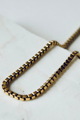 Close-up of vintage gold plated box chain necklace. 