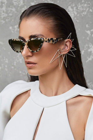 Model wearing Valley Eyewear Dayze sunglasses in bone tortoise frames with brown gradient lens. 