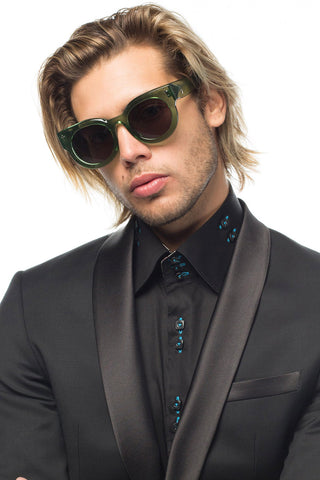 Model wearing Valley Eyewear A Dead Coffin Club Sunglasses in Bottle Green with Black Lenses