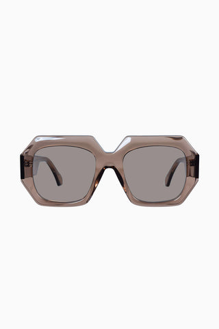 Valley Monolith sunglasses in transparent mocha with gold metal trim and light brown lenses. 