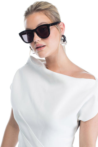 Model wearing Valley Eyewear Trachea Sunglasses Gloss Black with Black Lenses. 