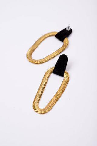 Black suede leather and brass 9e Avenue earring by Veinage. 