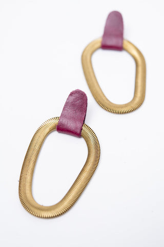 Raspberry leather and brass 9e Avenue earring by Veinage. 