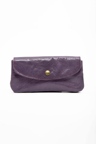 Purple leather wallet with brass snap closure. 