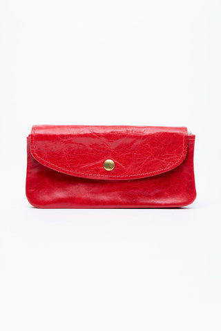 Red leather wallet with brass snap closure. 