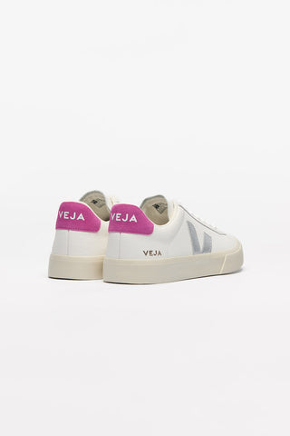 Back view of a pair of White + Silver + Ultraviolet Veja Campo Leather shoes against a white background. Body of shoe is white leather, Veja V logo is silver leather and detail on heel is bright pink suede.