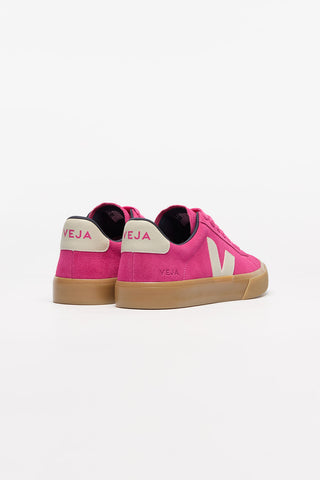 Back view of a pair of Pink + Pierre Veja Campo Suede shoes against a white background. Body of shoe is pink suede, Veja V logo is Pierre and soles are natural rubber. 