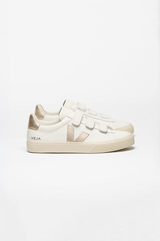 Pair of white Veja sneakers with light  gold V logo. 