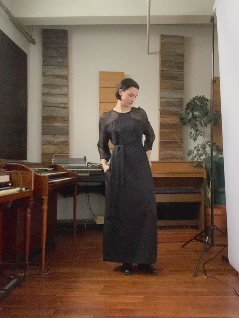 Video of model in music studio wearing black Betana dress by Jennifer Glasgow. 