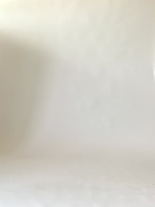 Model walking across screen wearing tan ramie zip up short The Sun playsuit by Jennifer Glasgow. 