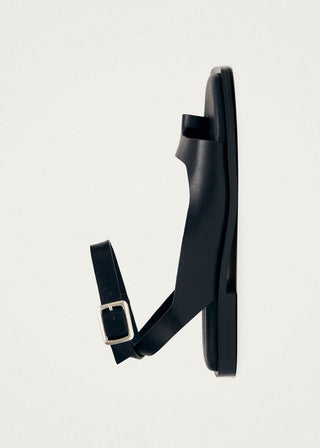 Black leather toe ring sandal with ankle strap. 