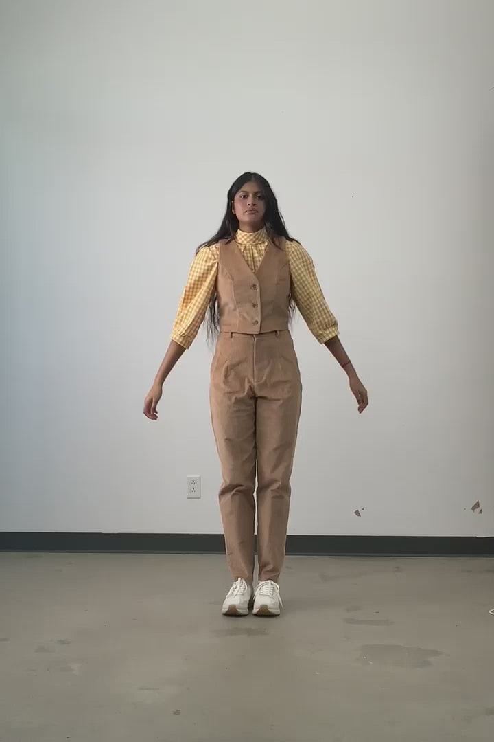 Video of model wearing the Jennifer Glasgow Bondi Blouse in yellow and white check flannel with corduroy vest and pants. 
