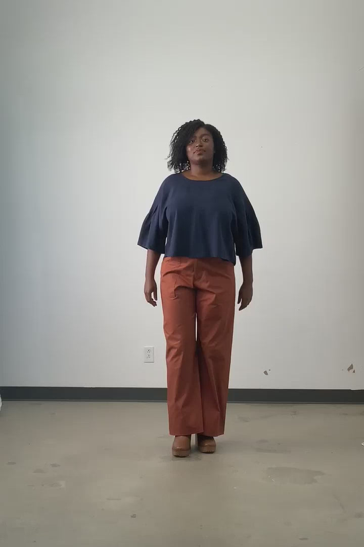 Video of model wearing Jennifer Glasgow Kairi top in navy Tencel. 