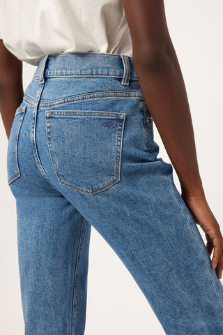 Back pockets of DL1961 Organic Cotton Patti Straight high rise jeans in vintage blue rapids wash. 