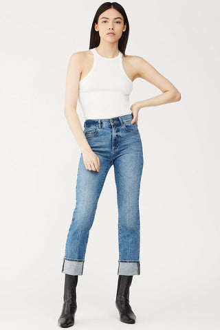 Model wearing DL1961 Patti straight leg high rise cuffed jeans. 