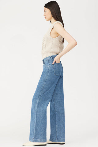 Side view of model wearing DL1961 Zoie Wide Leg jeans. 