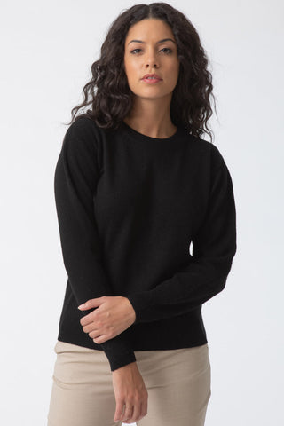 Model wearing black Yak wool O-Neck sweater by Dinadi. 