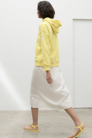 Side view of model wearing lemonade yellow organic and recycled cotton Bottrop Sweater by Ecoalf. 