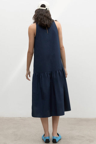 Model wearing navy organic cotton Malaquita dress by Ecoalf. 