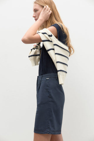 Side view of model wearing navy high waist organic cotton Po Shorts by Ecoalf. 