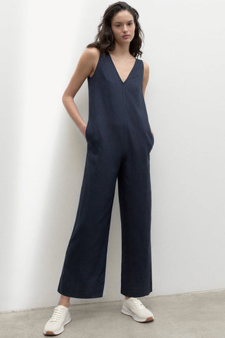 Model wearing navy relaxed fit wide leg Turquesa Jumpsuit by Ecoalf. 